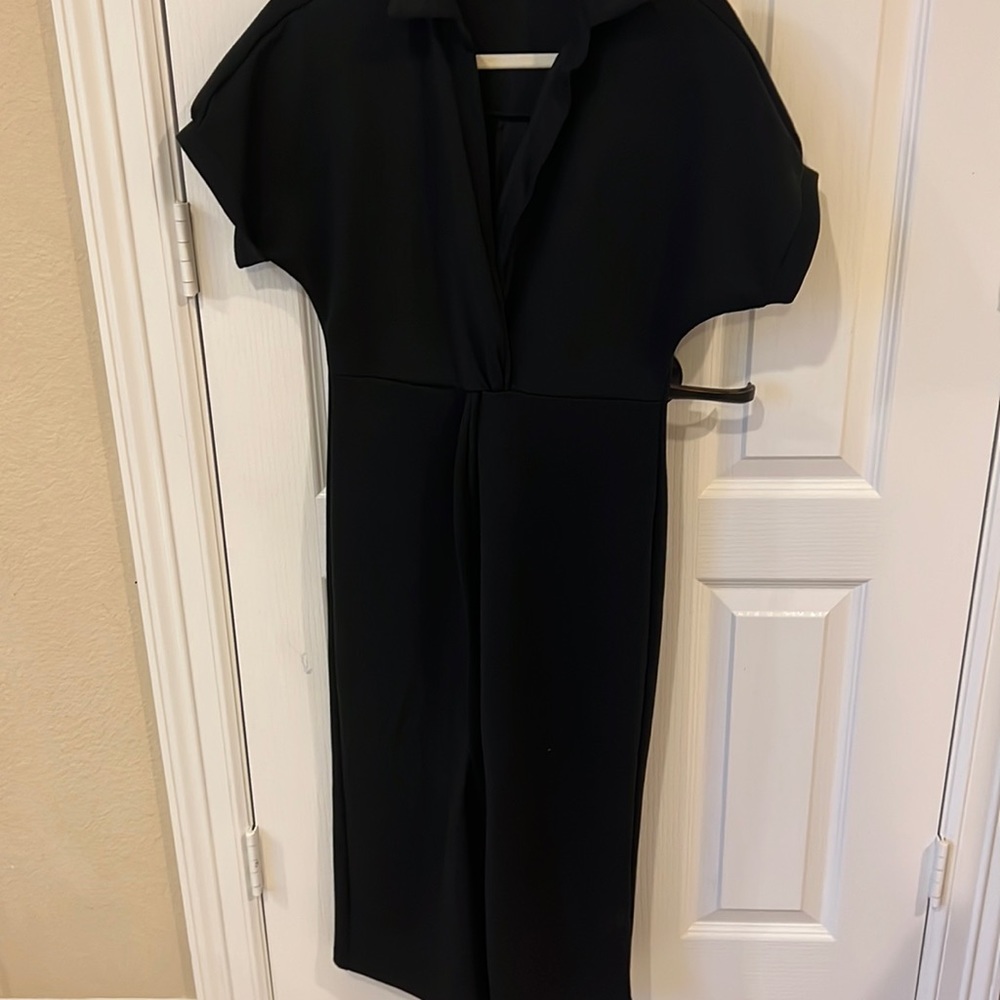 Basic black dress , soft cotton material can be dressed up or down . Worn once